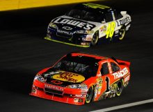 Jamie McMurray leads Jimmie Johnson during the closing stages of the Bank of America 500 at Charlotte Motor Speedway. Credit: John Harrelson/Getty Images for NASCAR